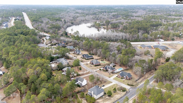 aerial view with a water view and a view of trees