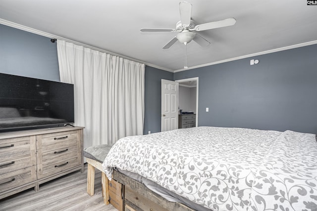 bedroom featuring light wood finished floors, ornamental molding, and a ceiling fan