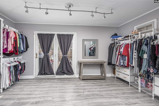 walk in closet featuring light wood-type flooring