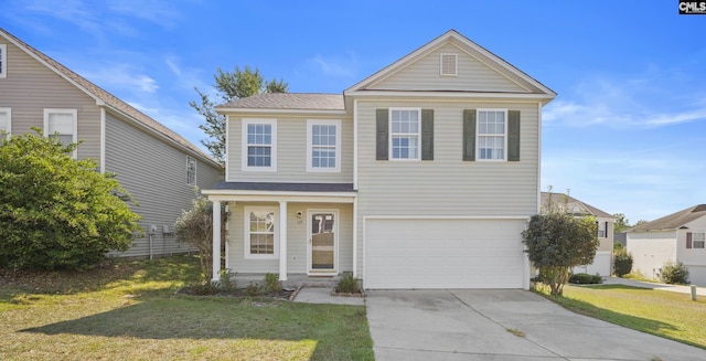 traditional-style house with a front yard, concrete driveway, and an attached garage