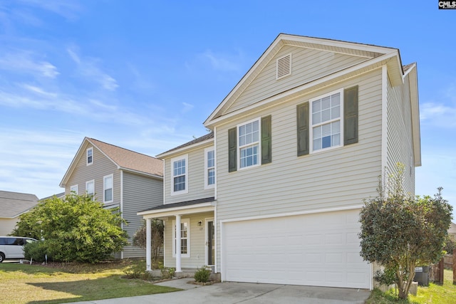 traditional home with driveway and an attached garage