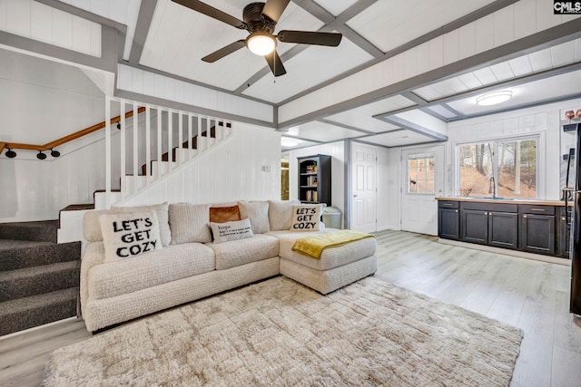 living room with light wood-style flooring, stairway, and a ceiling fan