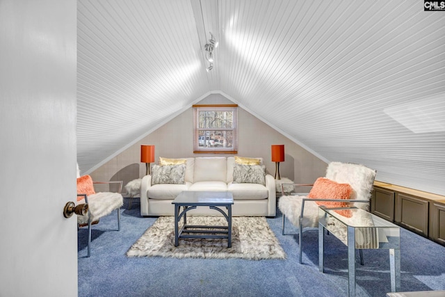 living area with vaulted ceiling, ornamental molding, rail lighting, and light colored carpet