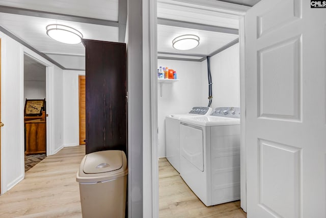 laundry room featuring light wood-style flooring and washing machine and clothes dryer