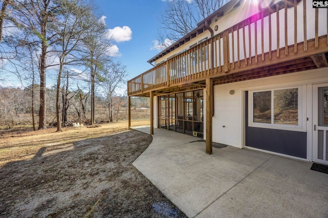 exterior space featuring a patio area and a wooden deck