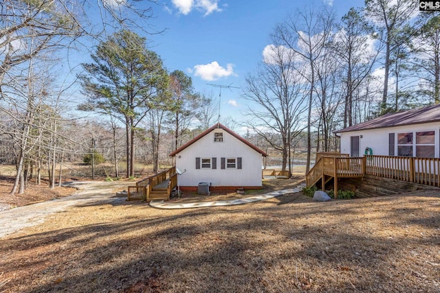 exterior space with a deck and central AC