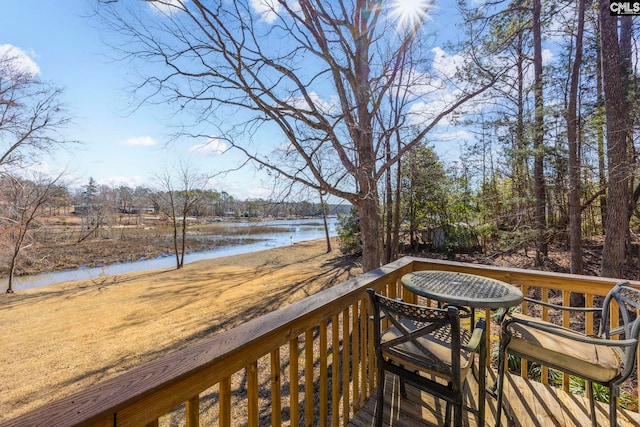 wooden deck with a water view