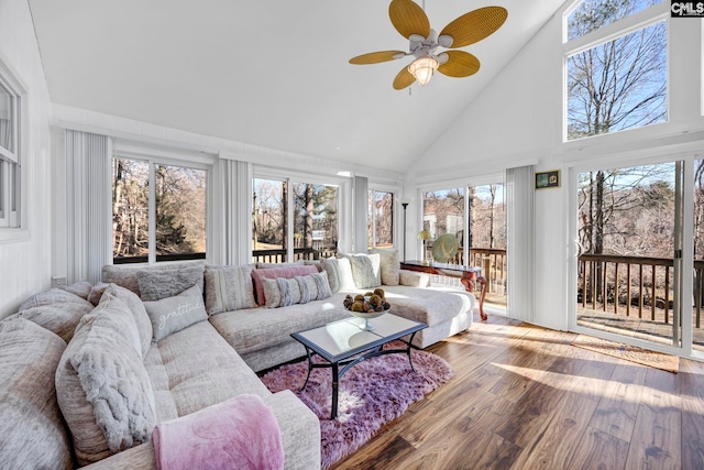 sunroom featuring a ceiling fan and lofted ceiling