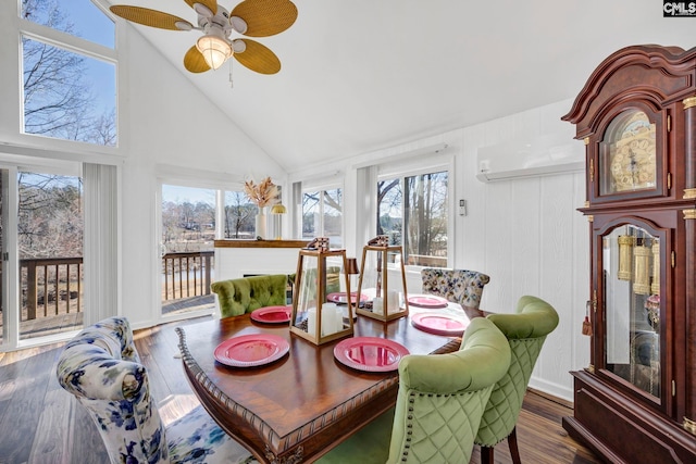 sunroom featuring a wall unit AC, ceiling fan, and vaulted ceiling