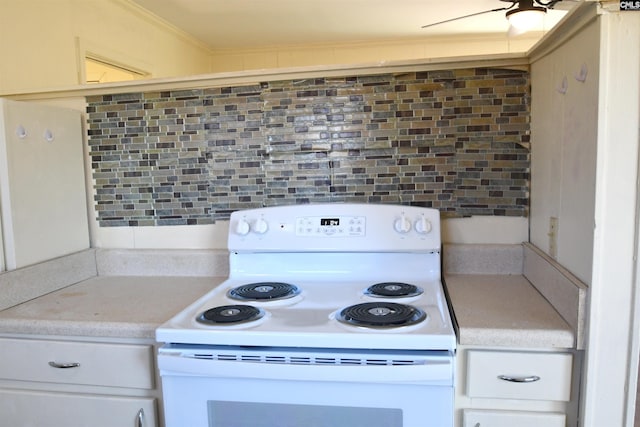 kitchen featuring white cabinets, light countertops, crown molding, and white range with electric cooktop