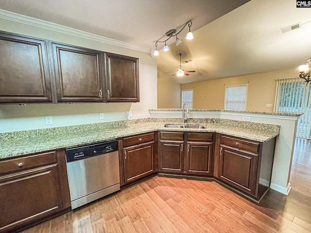 kitchen featuring light wood finished floors, visible vents, dark brown cabinetry, a sink, and dishwasher