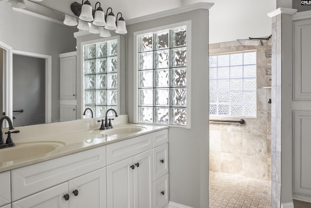 full bathroom featuring double vanity, a sink, and a walk in shower