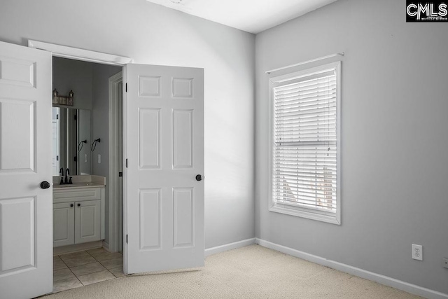 interior space with vanity and baseboards