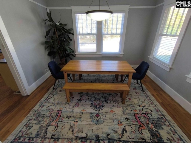 dining room with wood finished floors and baseboards