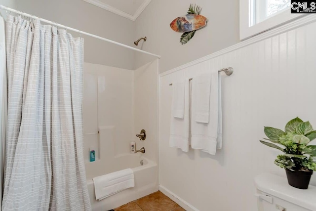 bathroom with toilet, crown molding, shower / bath combination with curtain, and tile patterned floors