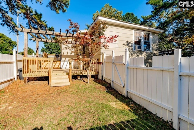 view of yard with a fenced backyard, a pergola, and a wooden deck