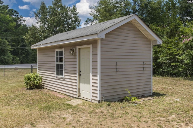 view of shed featuring fence