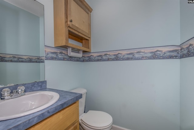 bathroom featuring toilet and vanity