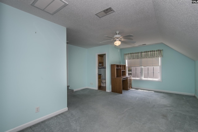 interior space featuring visible vents, ceiling fan, a textured ceiling, and carpet flooring