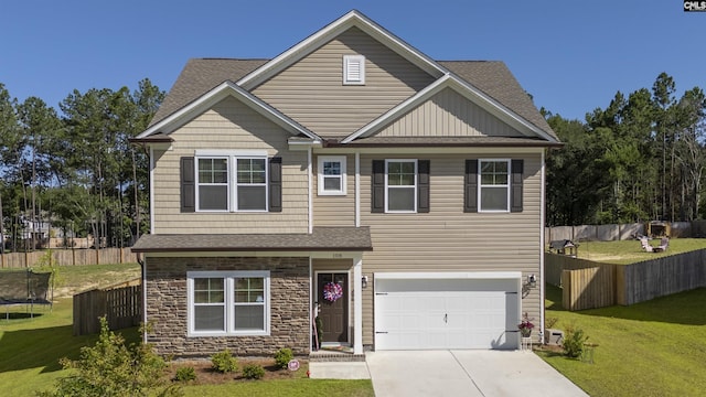 craftsman-style house featuring an attached garage, fence, stone siding, driveway, and a front yard