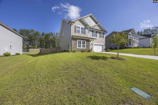 view of front facade with a front yard, stone siding, fence, and concrete driveway