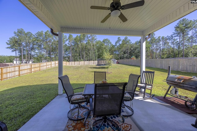 view of patio featuring a fenced backyard, outdoor dining area, a ceiling fan, and area for grilling