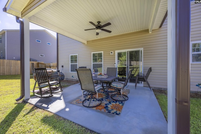 view of patio / terrace featuring a ceiling fan and fence