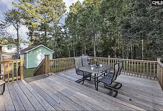 deck featuring an outbuilding and a storage shed