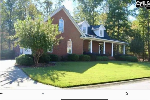 view of front of home with a porch and a front yard