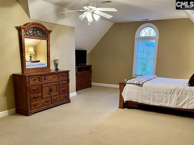 bedroom featuring light carpet, baseboards, visible vents, ceiling fan, and vaulted ceiling