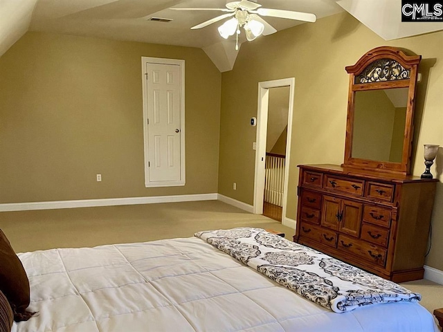 bedroom featuring a ceiling fan, lofted ceiling, visible vents, and baseboards