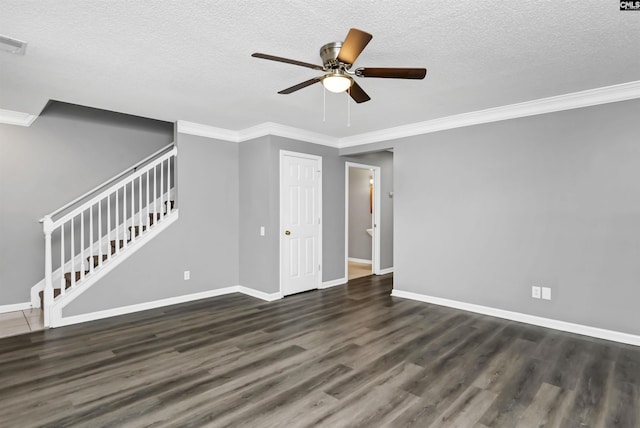 unfurnished living room with crown molding, dark wood-type flooring, stairway, and baseboards