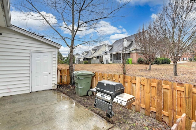 view of yard with fence and a patio