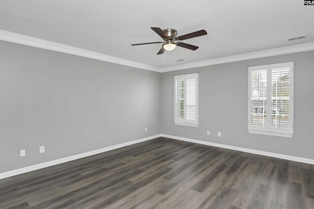 unfurnished room featuring crown molding, a wealth of natural light, and baseboards