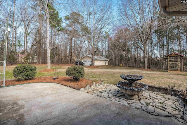 view of patio featuring an outbuilding