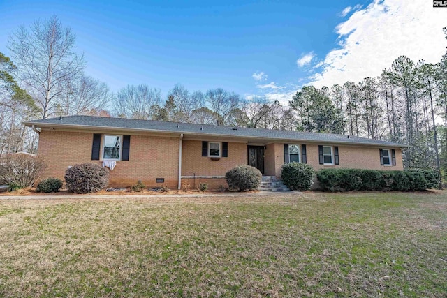 ranch-style home with crawl space, brick siding, and a front yard