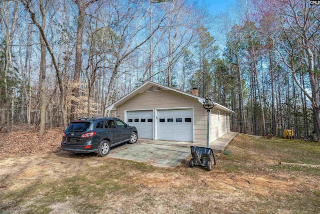 detached garage with fence