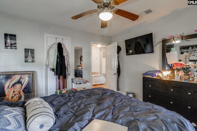 bedroom featuring a closet, visible vents, and a ceiling fan