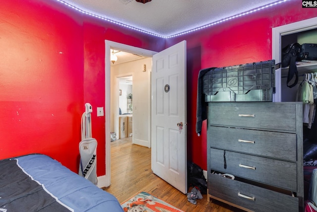 bedroom featuring wood finished floors