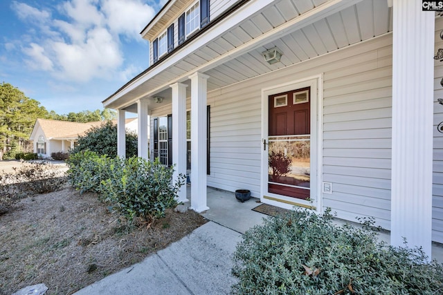 doorway to property with a porch