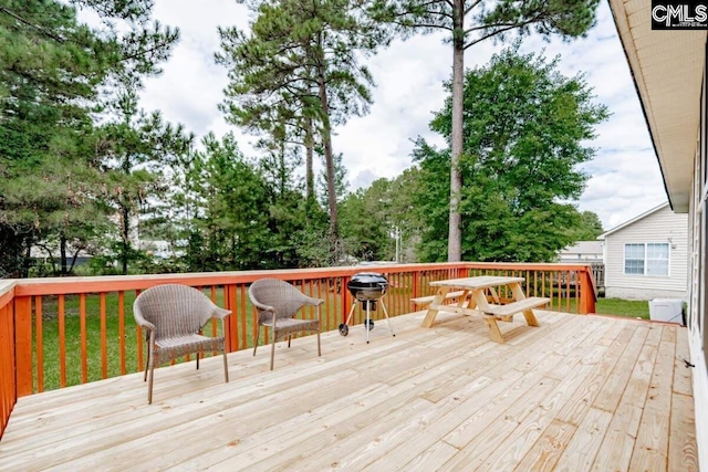 deck featuring outdoor dining area