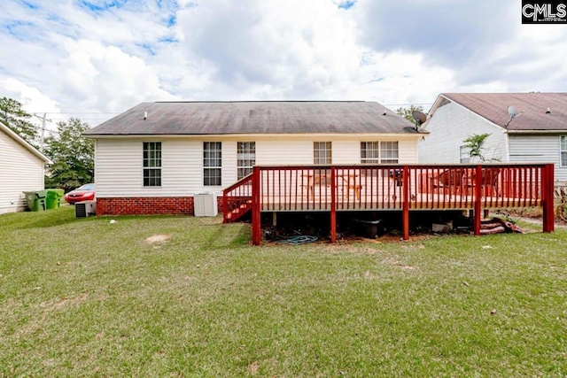 back of house with a lawn and a wooden deck