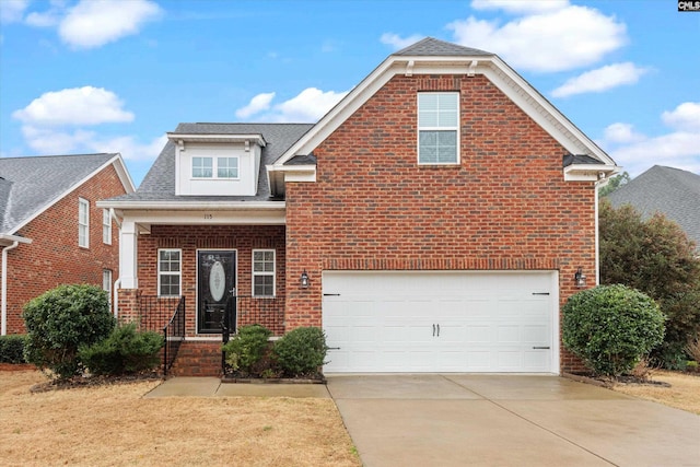 traditional home with a garage, concrete driveway, brick siding, and roof with shingles