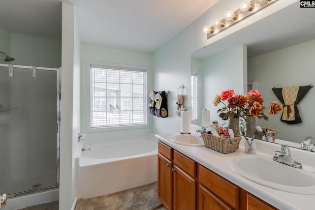 full bath with a sink, a shower stall, and a bath