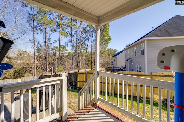 deck with a fenced backyard