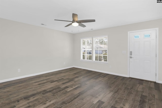 entrance foyer with dark wood-style floors, baseboards, visible vents, and a ceiling fan