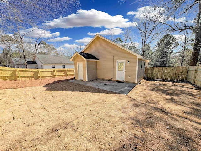 view of outdoor structure featuring a fenced backyard