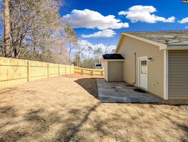 view of yard with a patio area and a fenced backyard