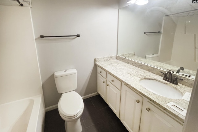 bathroom with baseboards, vanity, toilet, and walk in shower