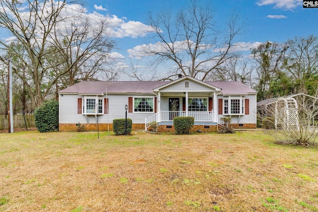 view of front of home featuring crawl space, covered porch, a front lawn, and metal roof